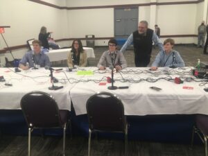 youth at quiz bowl table